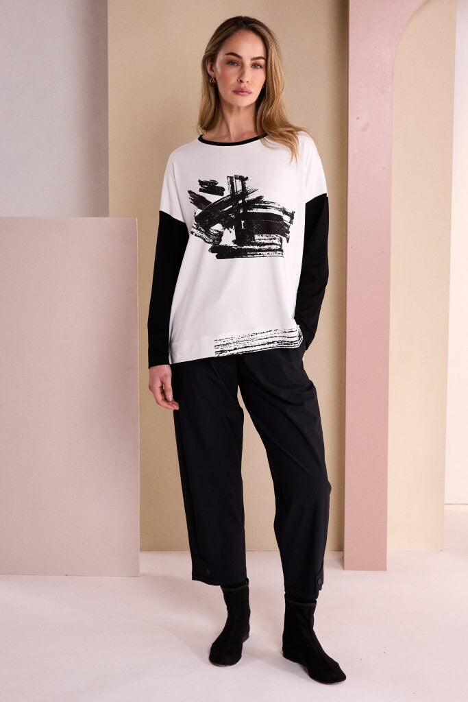 Naya tapered trousers styled with striped top and trainers