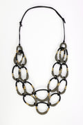 Naya NAW26340 large loop statement necklace in black and muted gold tones