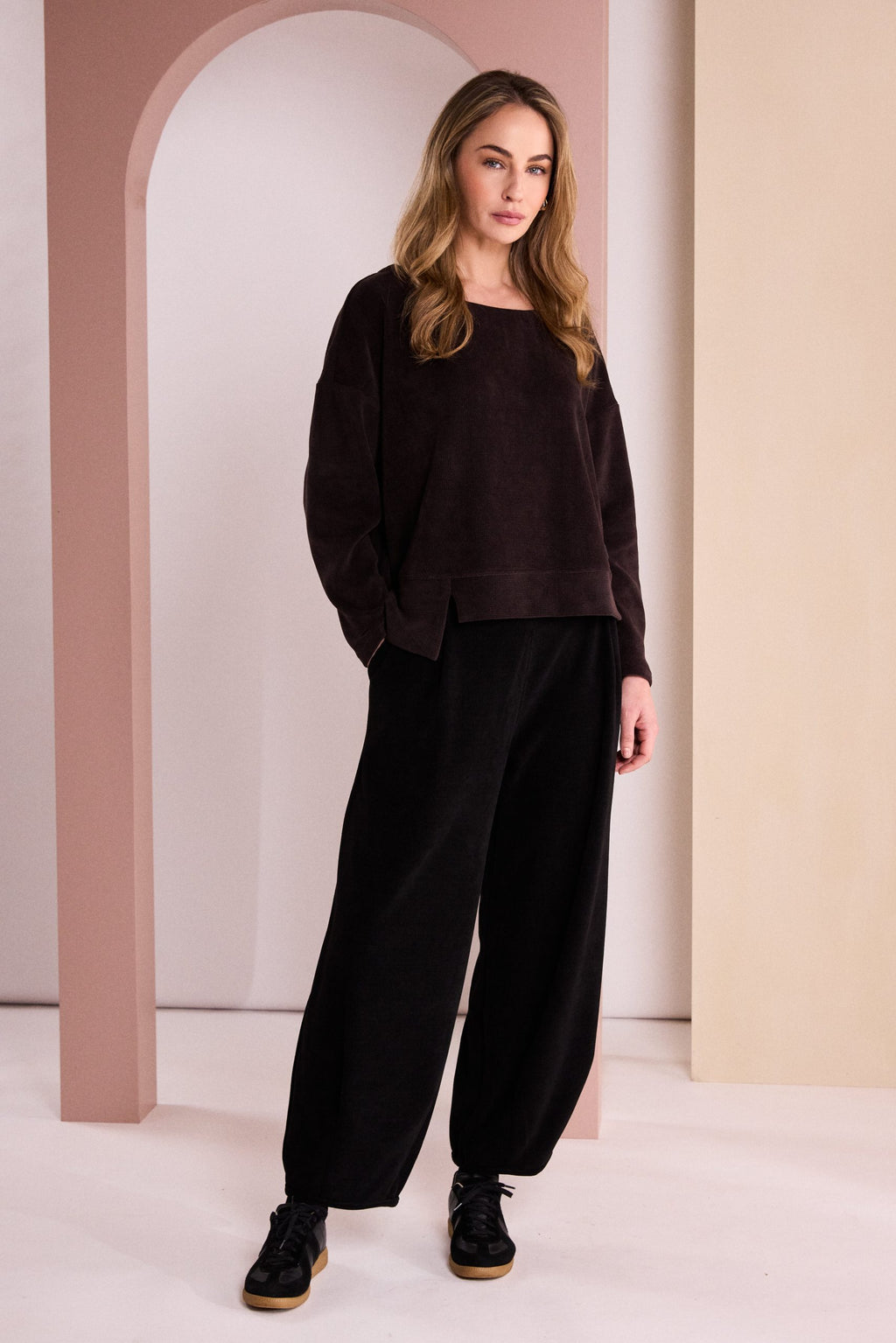 Naya soft cord trousers styled with coordinating funnel neck top and trainers