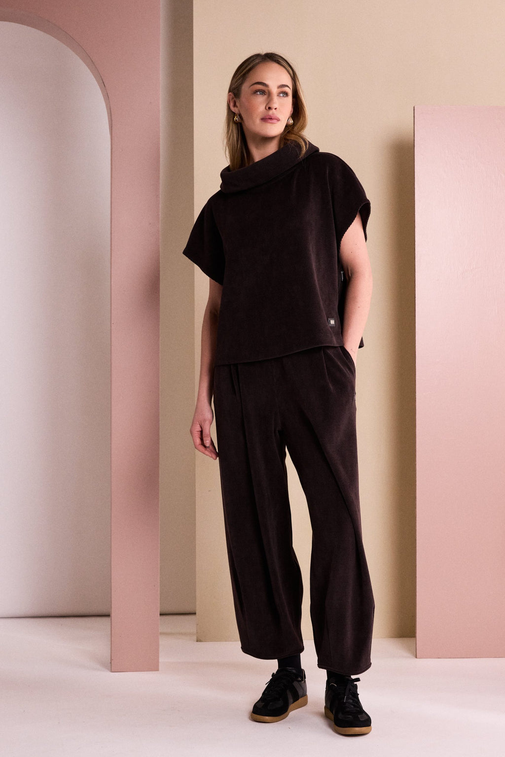 Naya soft cord trousers styled with coordinating funnel neck top and trainers