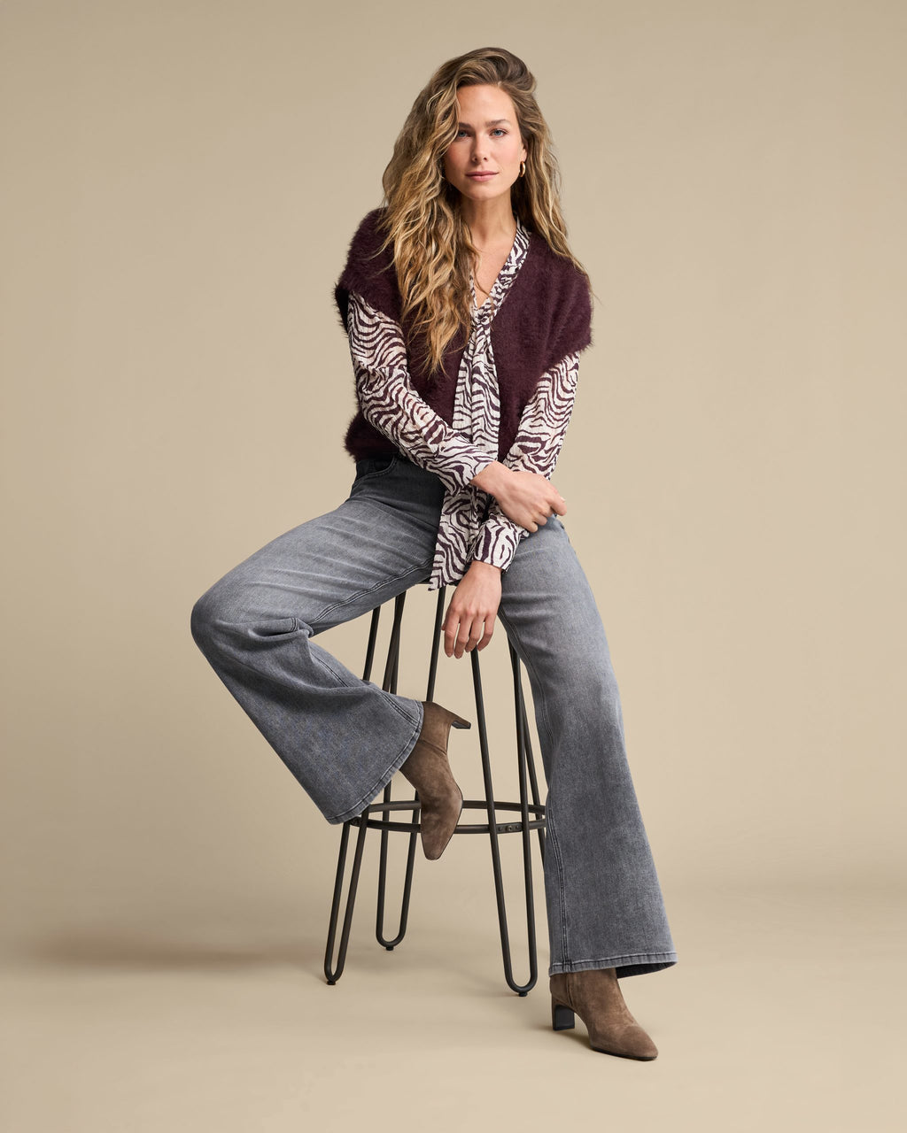 Red Button Zebra Blouse Burgundy SRB5061 styled with sleeveless fuzzy cardigan and wide leg jeans